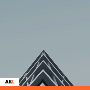 Nowoczesny budynek biurowy sfotografowany od dołu na tle nieba – szkolenie Bezpieczne środowisko pracy w szpitalu przeciwdziałanie mobbingowi